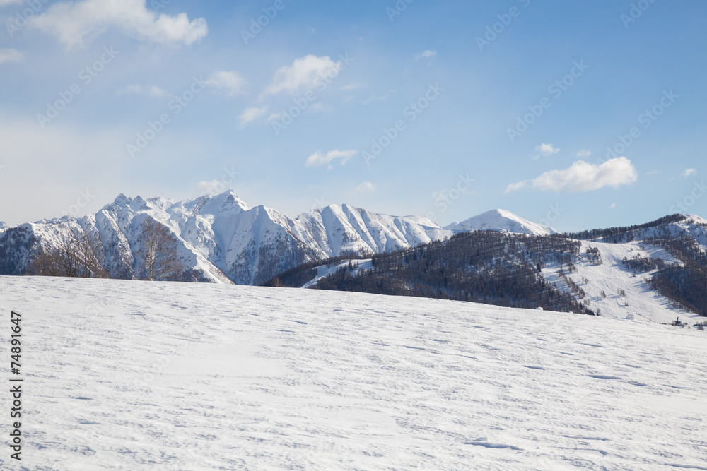 snowy mountains with clouds
