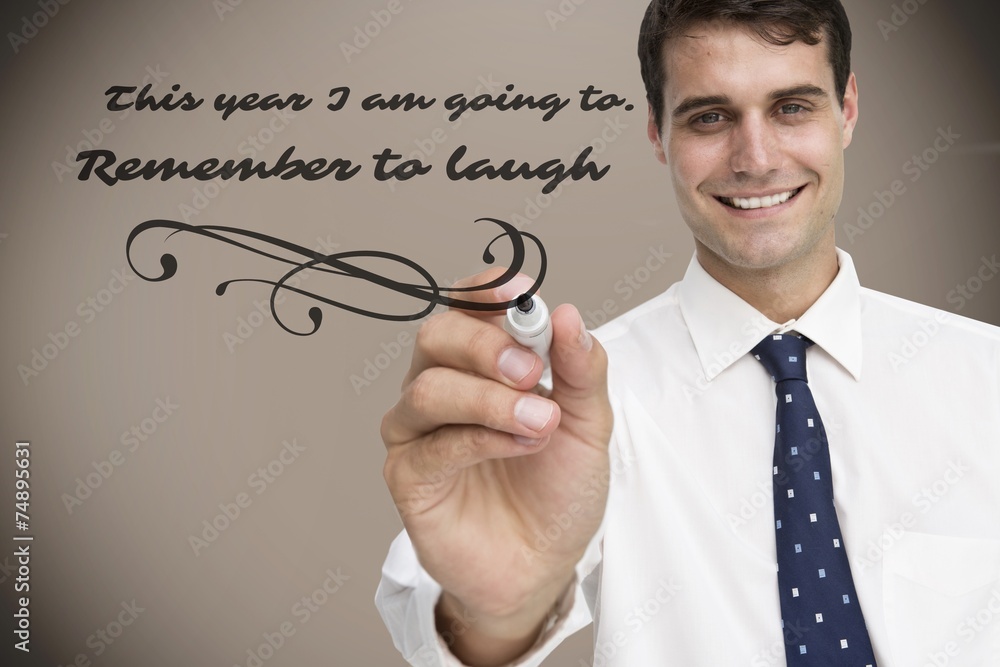 Composite image of smiling businessman holding marker Composite image of smiling businessman holding marker