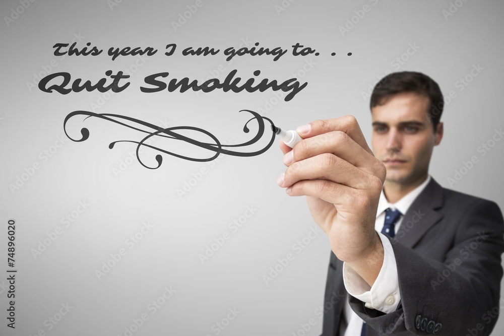 Composite image of concentrated businessman holding red marker Composite image of concentrated businessman holding red marker
