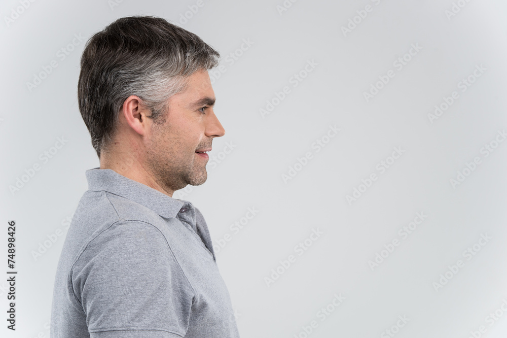 Fototapeta premium Profile view of smiling confident business man.