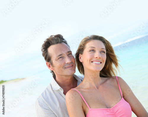 Portrait of loving middle-aged couple at the beach