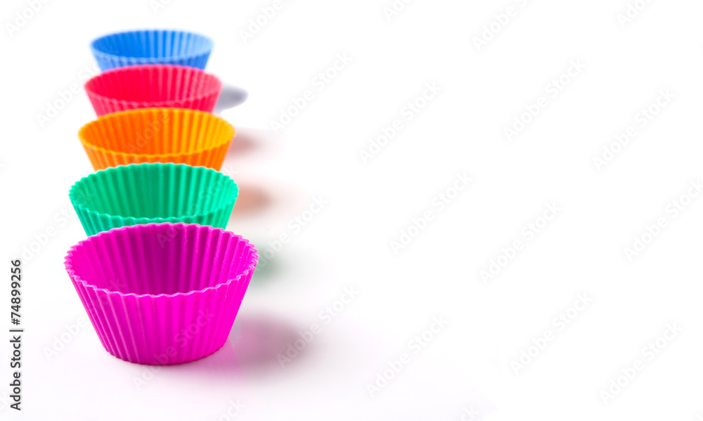 Cupcake silicone baking cups over white background Cupcake silicone baking cups over white background