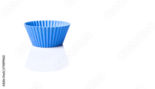 Blue silicone baking cups over white background 