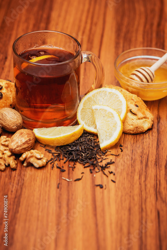 Fototapeta Naklejka Na Ścianę i Meble -  black tea with lemon and honey