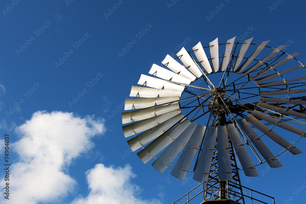 Wind mill against a blue sky