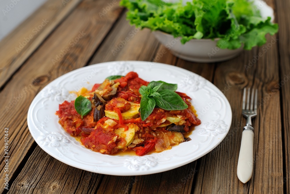 French tian with tomato, zuccini and aubergine garnished with fr