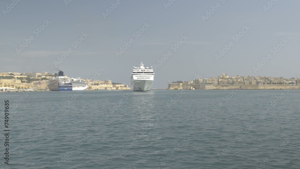 Cruise ship is maneuvering in Valletta, Malta Cruise ship is maneuvering in Valletta, Malta