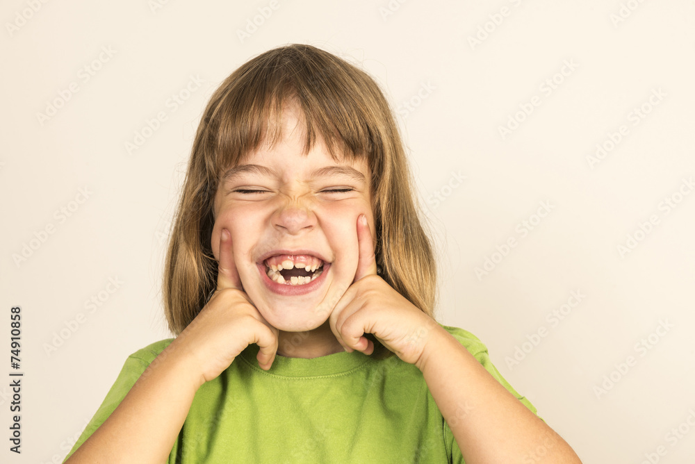 Little girl smiling with eyes closed Little girl smiling with eyes closed
