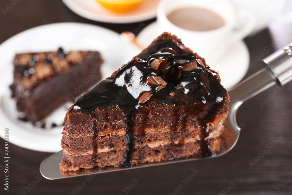 Yummy chocolate cake served on table, close-up Yummy chocolate cake served on table, close-up
