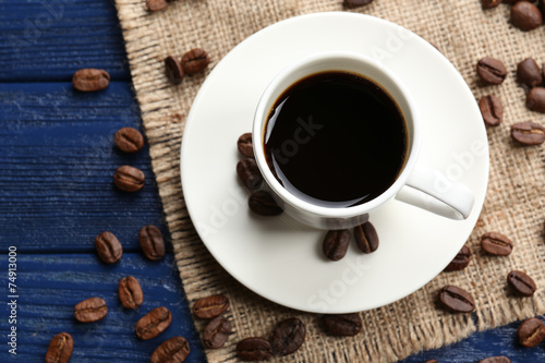 Cup of coffee on wooden table