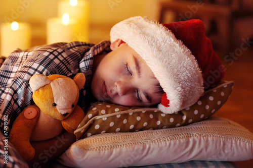 Little boy sleeping near fi...