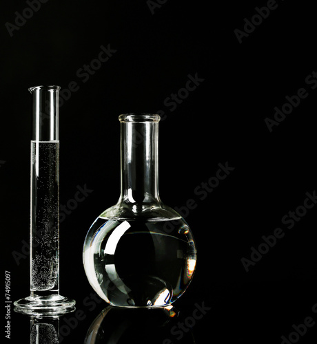 Test tubes with liquid on dark background