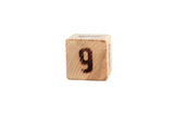 number 9 on the wooden cube