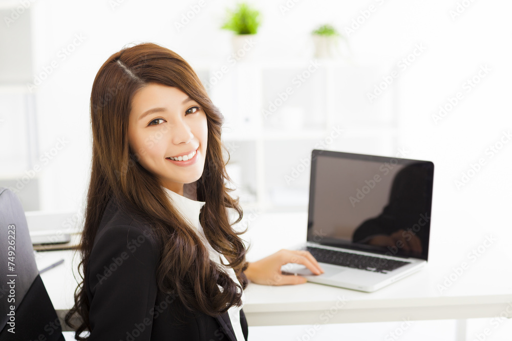 happy young business woman working in the office happy young business woman working in the office