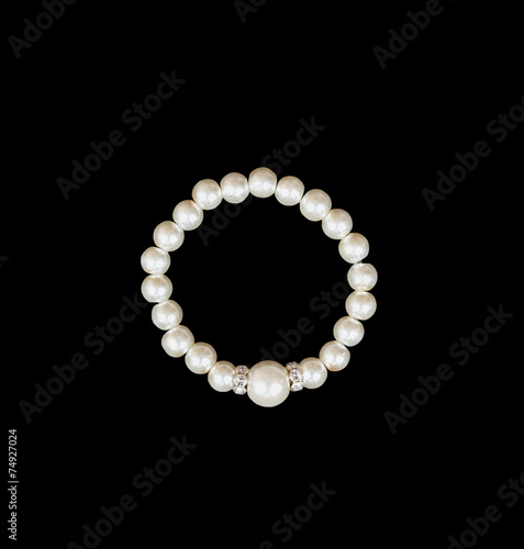 White pearls on the black background