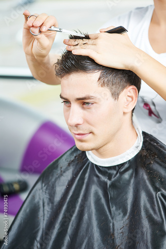 Male hairdresser at work