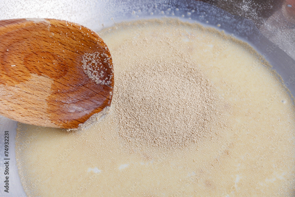 How to make yeast dough - step by step: mix dry yeast with milk Stock ...