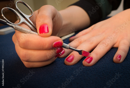 manicure and nail polish on pretty female fingers