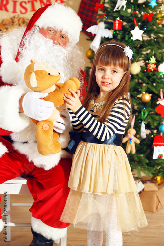 Santa Claus giving  present...