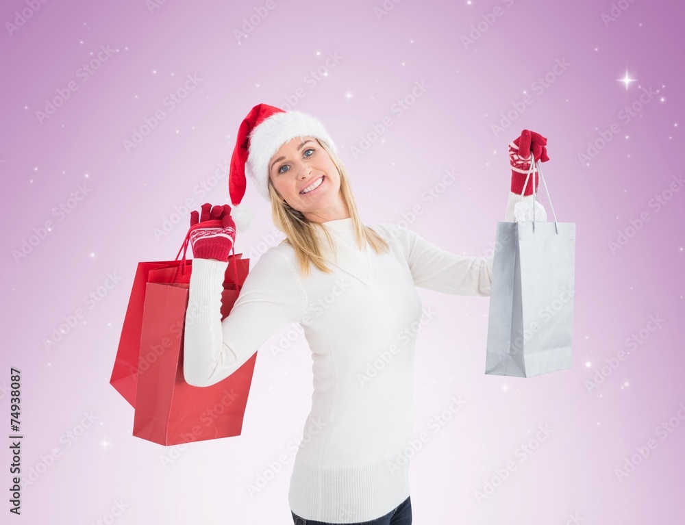 Festive blonde holding christmas gifts Festive blonde holding christmas gifts
