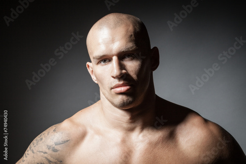 Canvastavla portrait of strong man isolated on dark background