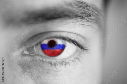 Men portrait with eyes the color of Russia flag