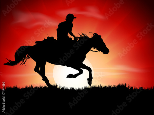 Silhouette of the equestrian of the jockey riding on sunrise