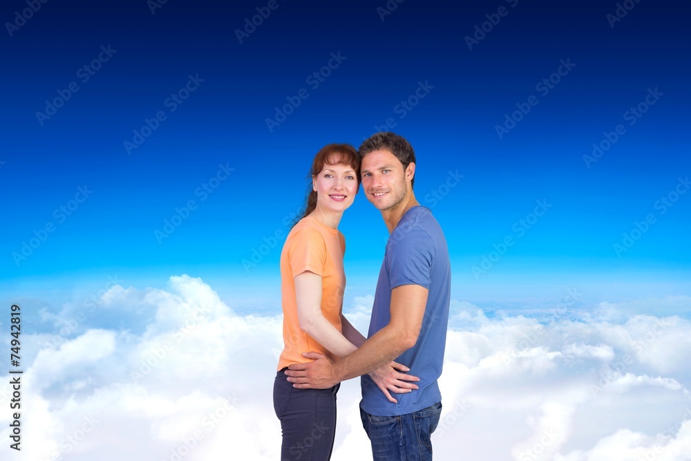 Composite image of couple looking at the camera Composite image of couple looking at the camera