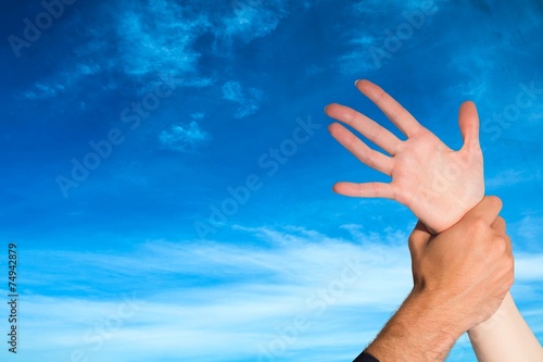 Composite image of womans wrist held by man