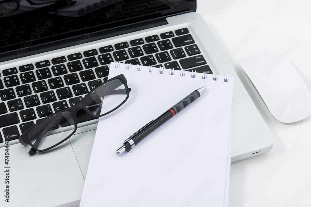 Blank business laptop, mouse, pen, glasses and note Blank business laptop, mouse, pen, glasses and note