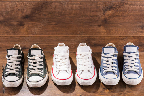 multicolored youth gym shoes on floor