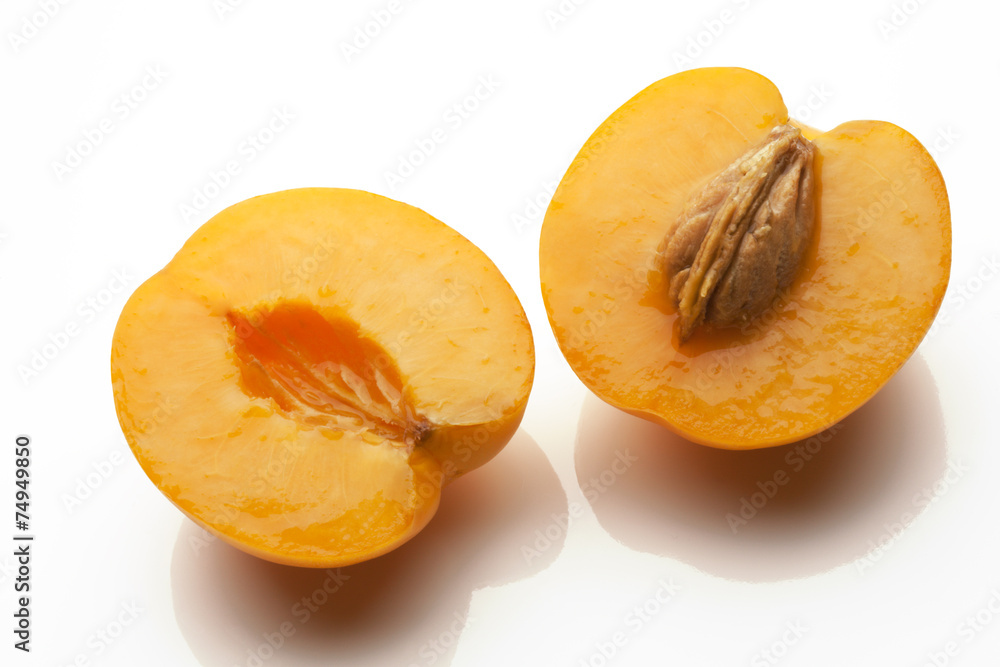 juicy apricots sliced isolated on white background