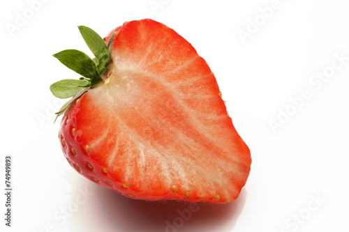 sliced strawberry on white