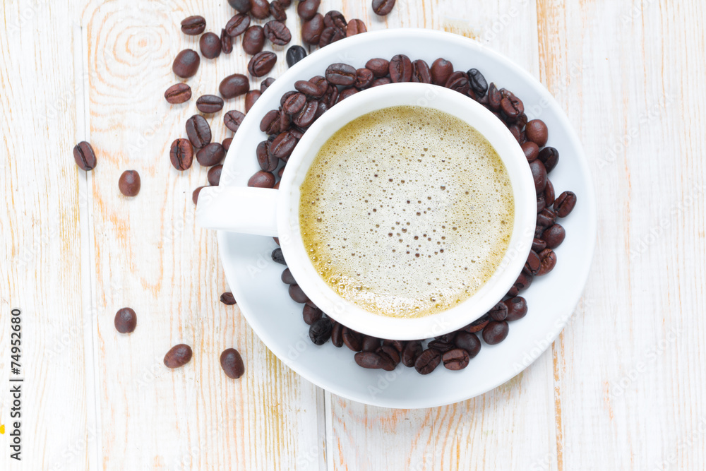 Top view a cup of coffee on wooden table Top view a cup of coffee on wooden table