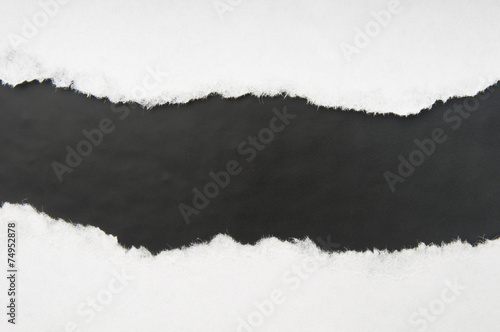 Torn white paper with black space photo
