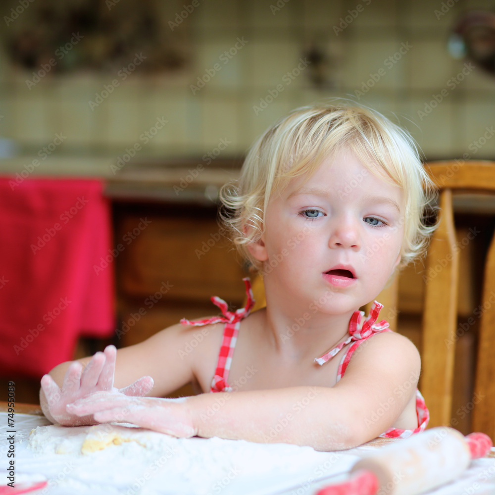 Little girl making cookies in the kitchen Little girl making cookies in the kitchen