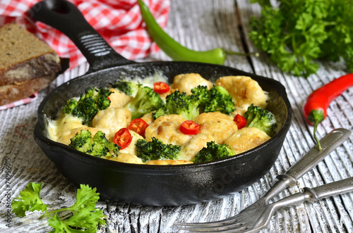 Chicken meatballs with broccoli.