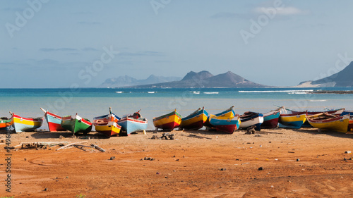 Fishing boats rest in Mindelo beach. photo
