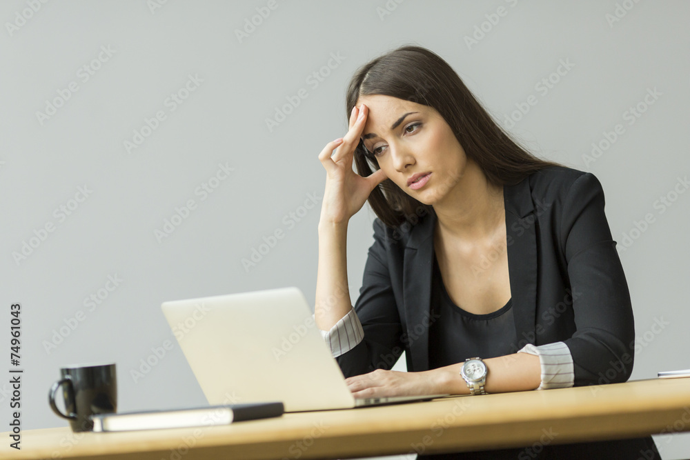 Young woman working in the office Young woman working in the office