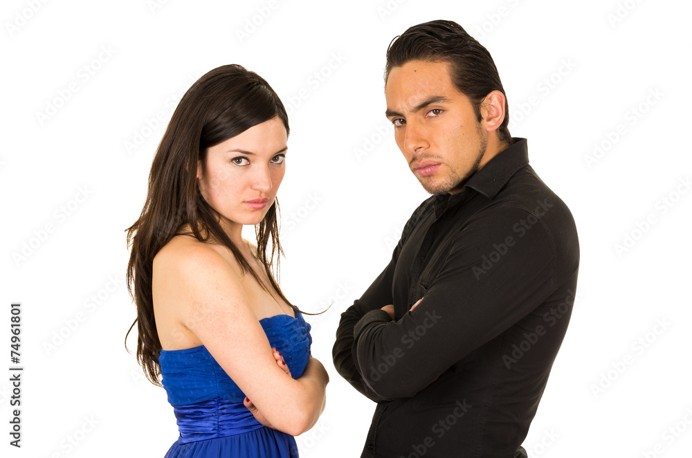young attractive couple fighting with arms crossed young attractive couple fighting with arms crossed