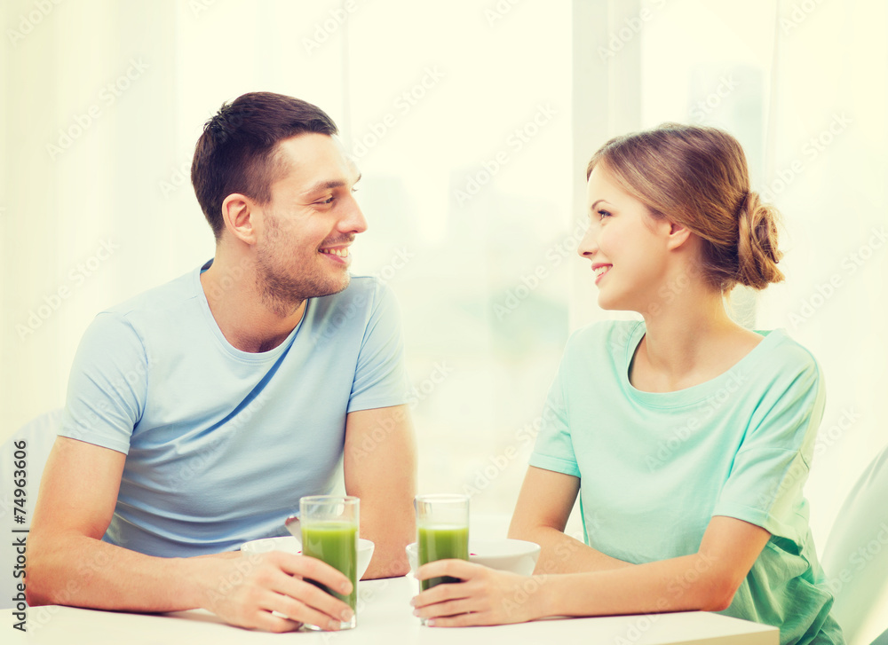smiling couple having breakfast at home smiling couple having breakfast at home
