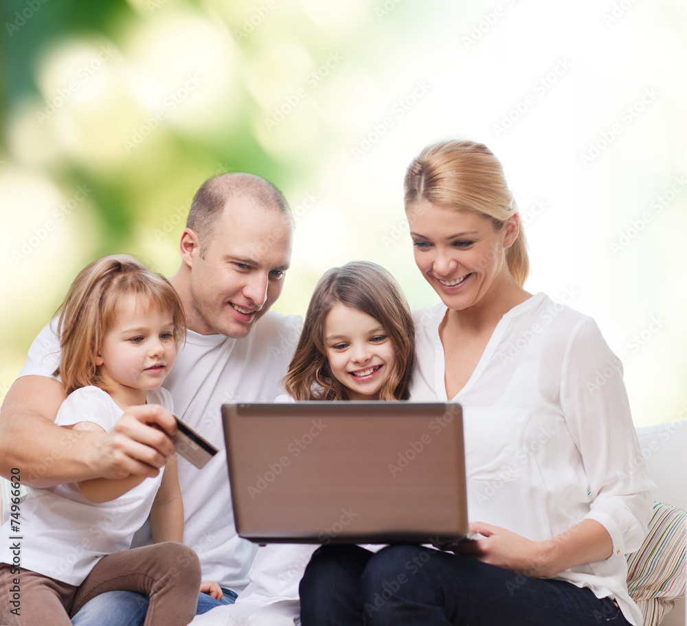 happy family with laptop computer and credit card happy family with laptop computer and credit card