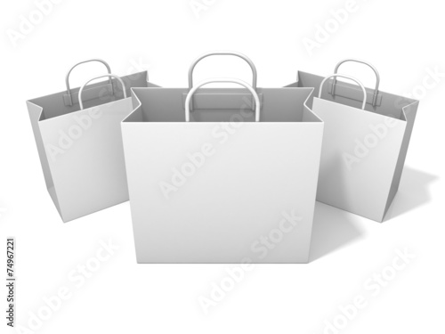 Three empty shopping paper bag, isolated on white. Front view