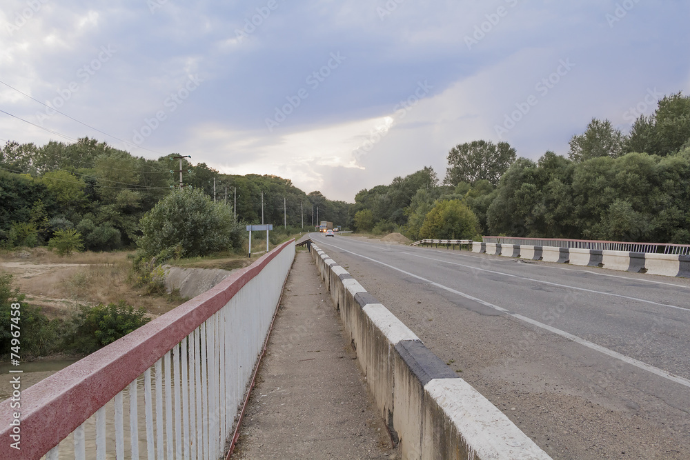 Bridge over a small river in the evening