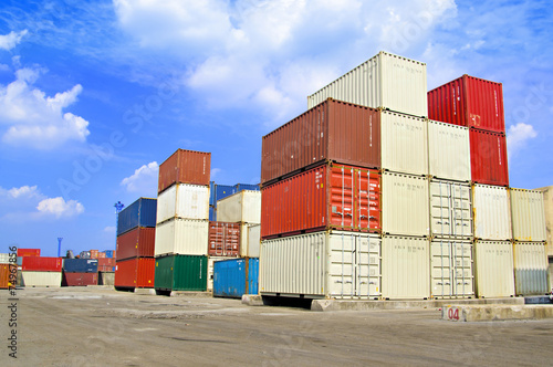 Stacked cargo containers in storage area of freight sea port ter