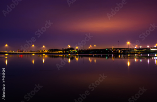 Lights and highways reflecting in the Potomac River at night, se