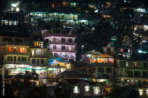 Houses at Himalaya mountains at night in Dharamsala, India © OlegD