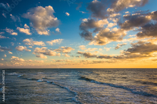 Sunset sky over waves in the Gulf of Mexico, in Naples, Florida