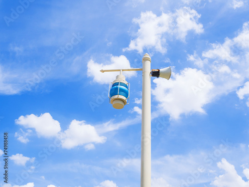 electric street lamp on blue sky