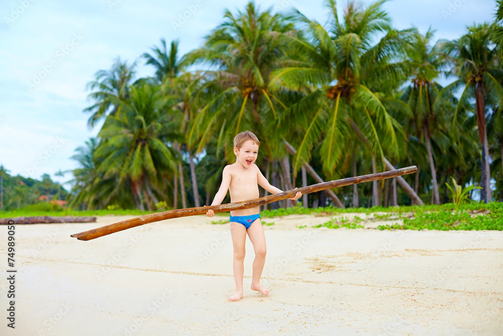 happy boy enjoys life on tropical island happy boy enjoys life on tropical island